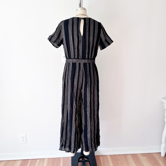 Sadie & Sage Black and Cream Jumpsuit with Peekaboo Detail and Front Tie Striped - Picture 4 of 7